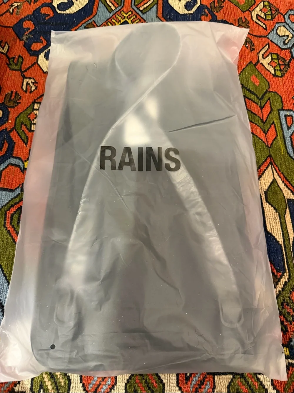 Rains Matte Black Minimalist Backpack